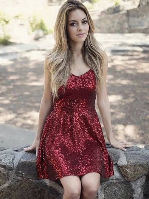 Holiday party outfit after image - person in a red sparkling holiday dress with festive mood