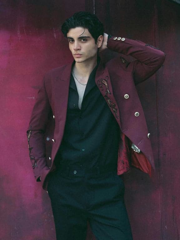 a portrait of a person transformed into an American Gothic–style painting with rigid posture, serious expression, muted earthy tones, flat lighting, and strong compositional order