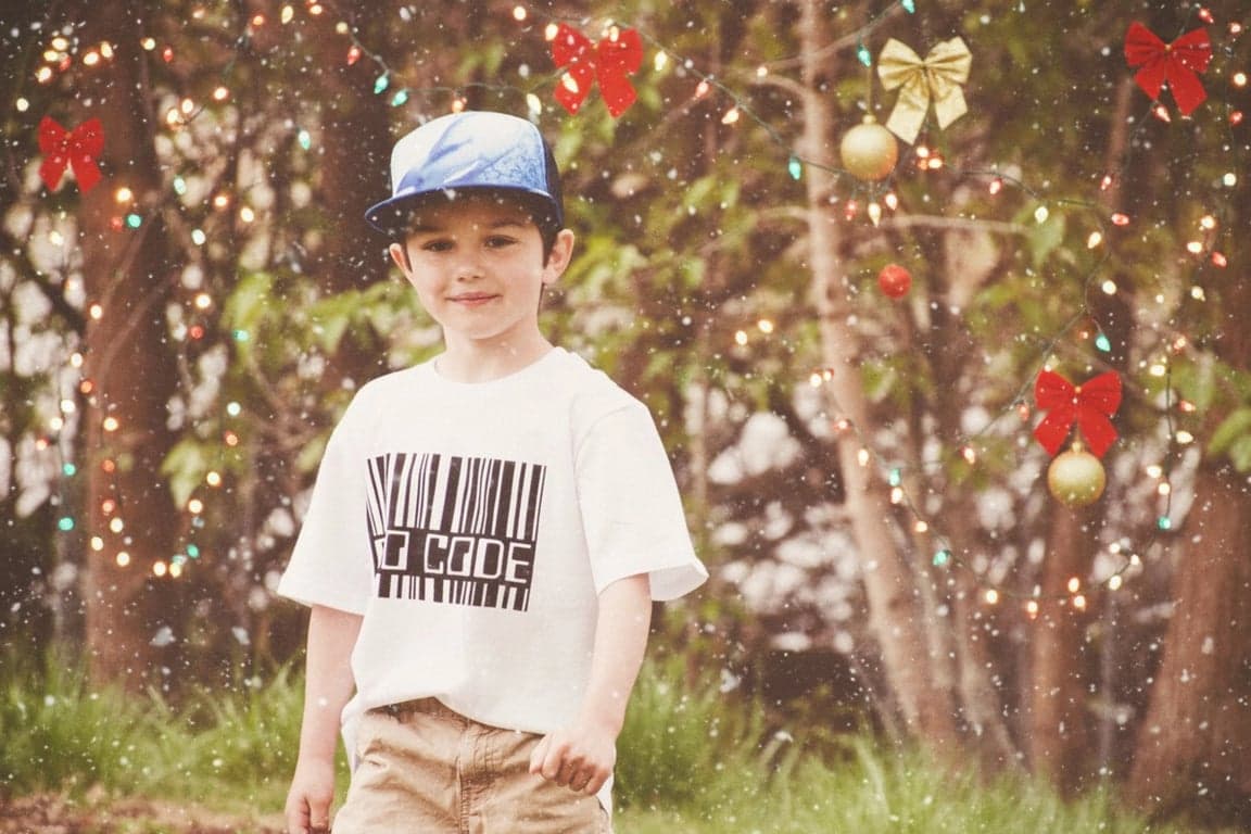 AI baby Christmas photo after photo - boy wearing a hat with Christmas decoration