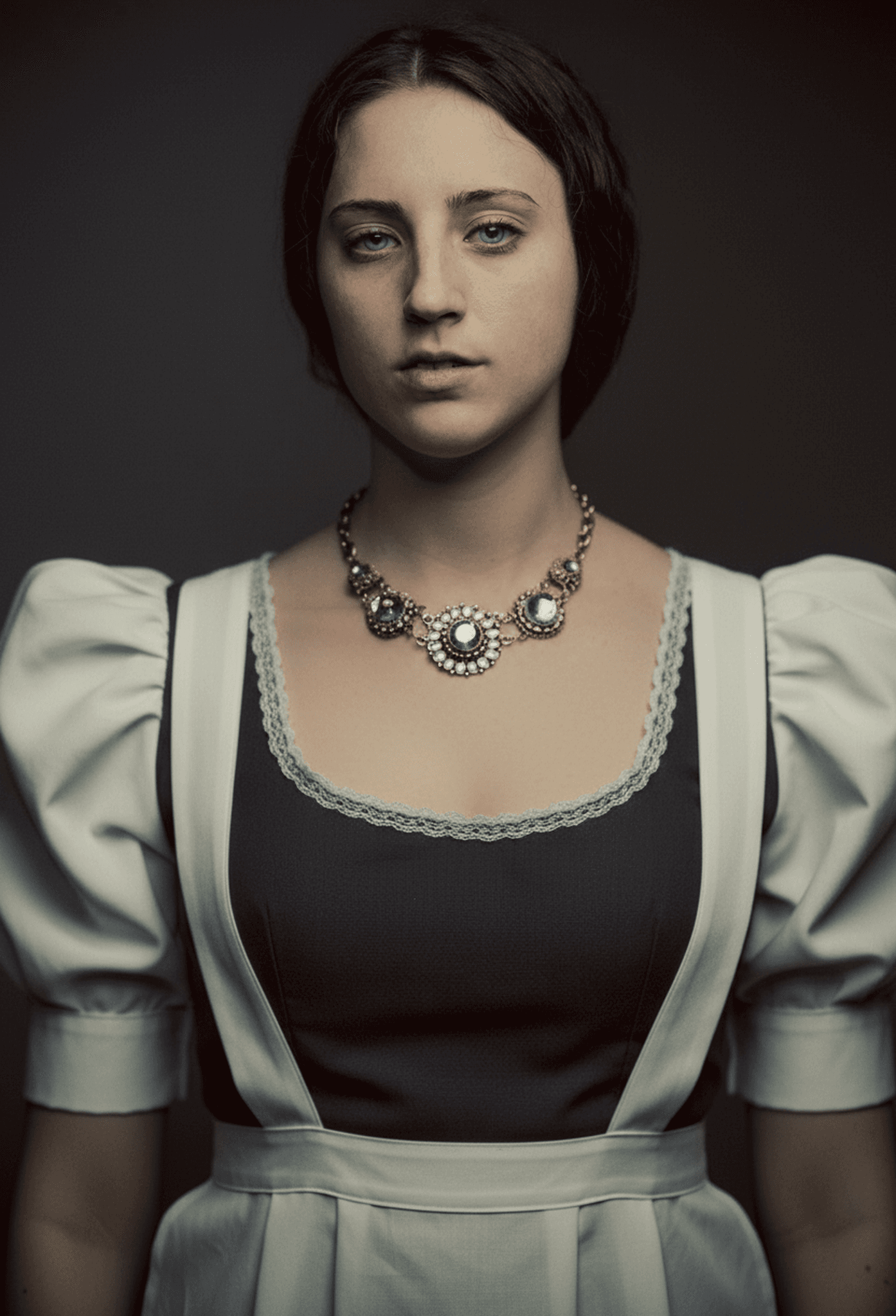 Rendered in a Victorian inspired maid uniform with puffed sleeves and lace trim accents.