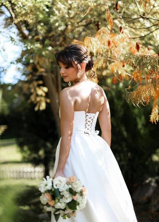 a portrait of a person enhanced with classic old camera characteristics, including blur, grain, and faded contrast