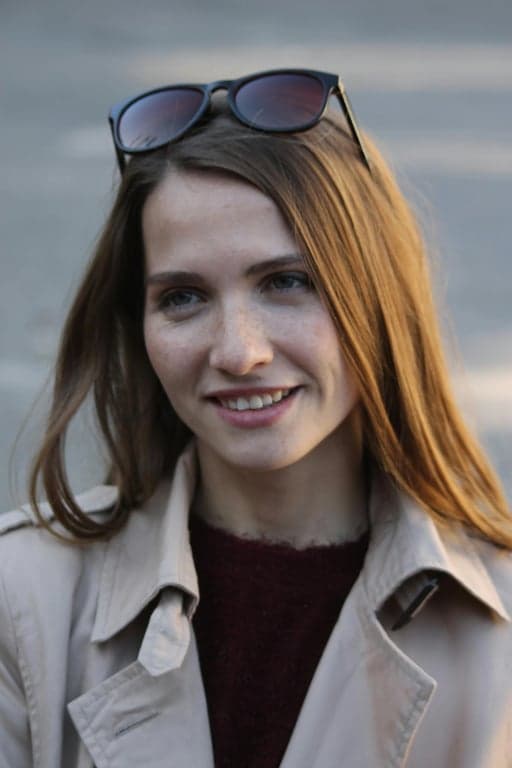 a portrait of a person enhanced with realistic golden hour lighting logic, emphasizing directional sunlight, warm highlights, controlled shadow depth, and authentic outdoor light feel