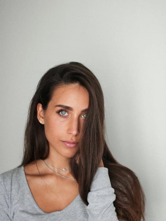 a portrait of a person enhanced with contemporary fashion styling, modern outfit structure, refined color coordination, relaxed confident pose, smooth lighting, and minimal modern backdrop