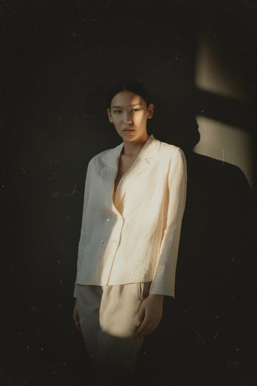 a portrait of a person styled with a vintage camera aesthetic, focusing on age, texture, and optical limitations