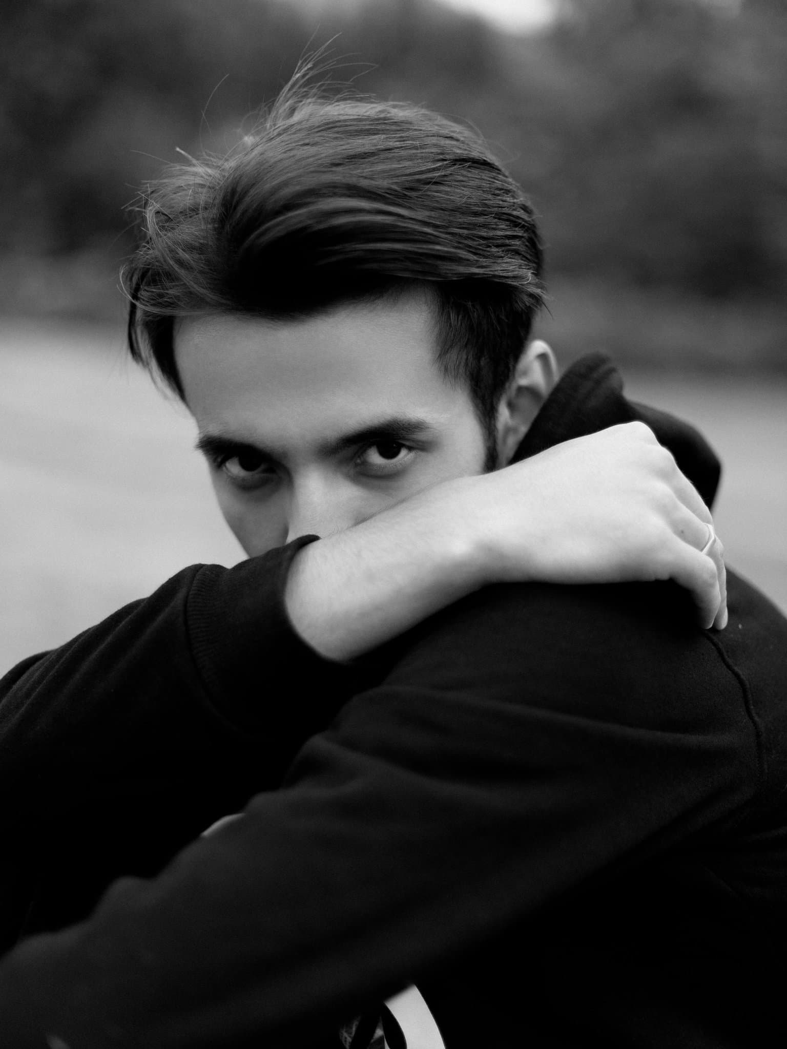 A close-up portrait of a person with neutral studio lighting.