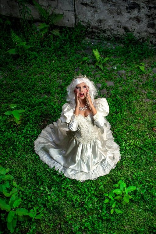 A portrait of a person converted into a fully animated My Little Pony pony, standing on all four legs, following official animation rules, completely eliminating arms, hands, fingers, and upright human posture, mapping identity through mane shape, eye emotion, and color palette, preserving original background, lighting, and mood, flat pastel cel shading, clean outlines, and a clearly visible cutie mark.