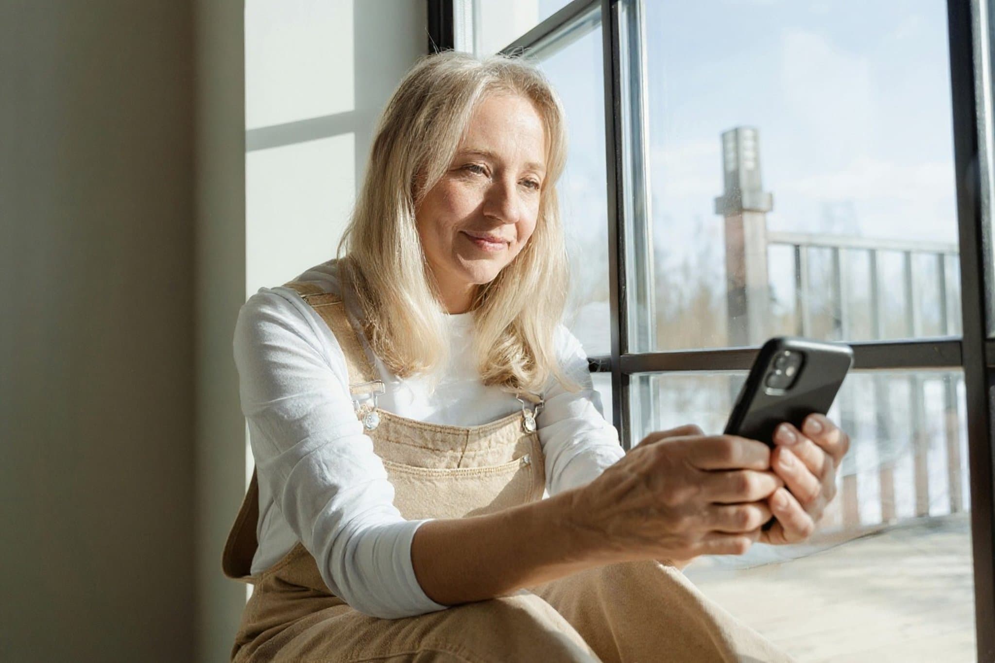 AI wrinkle remover filter after transformation - selfie with clear skin and wrinkle-free look