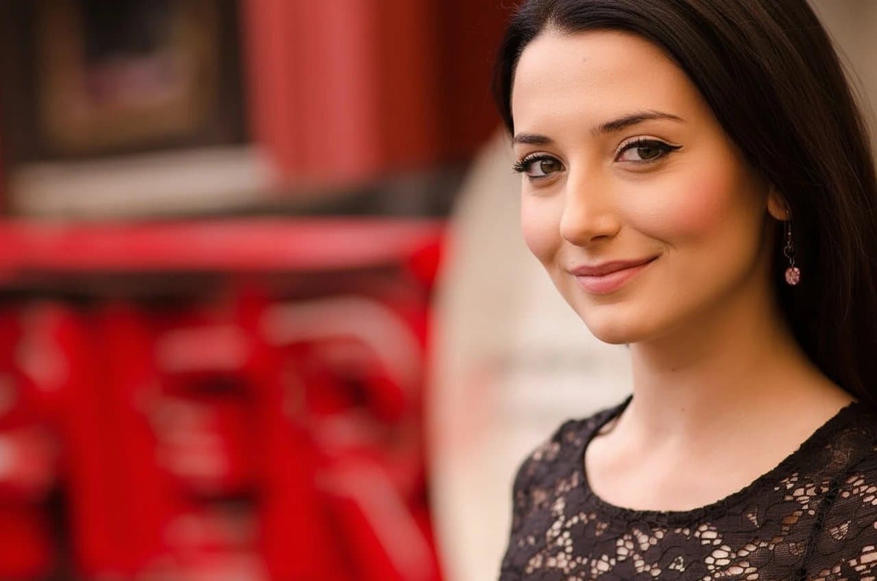 AI smile filter after transformation - studio photo with subtle happy expression