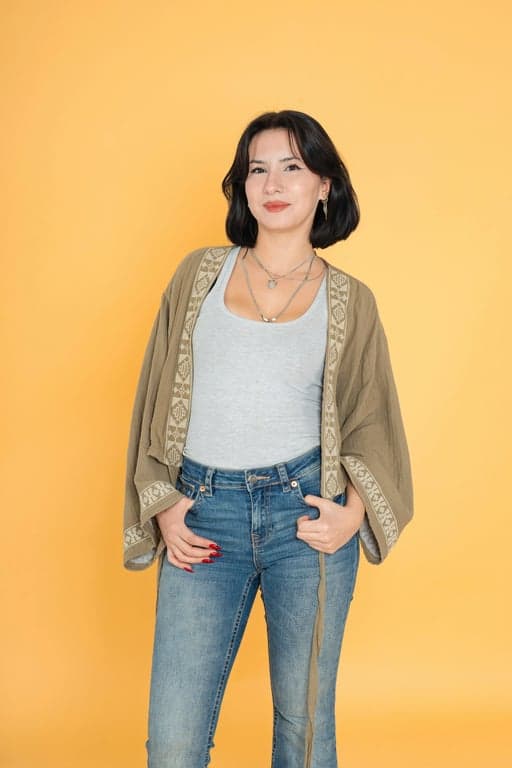 a portrait of a woman, digital id portrait, high resolution, consistent lighting, no shadows on face or background, direct gaze.