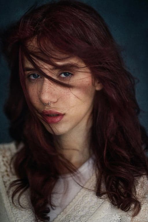 a portrait of a person enhanced with Korean street fashion styling, oversized casual layers, modern color blocking, confident relaxed stance, natural expression, balanced daylight, and a simple street-inspired backdrop