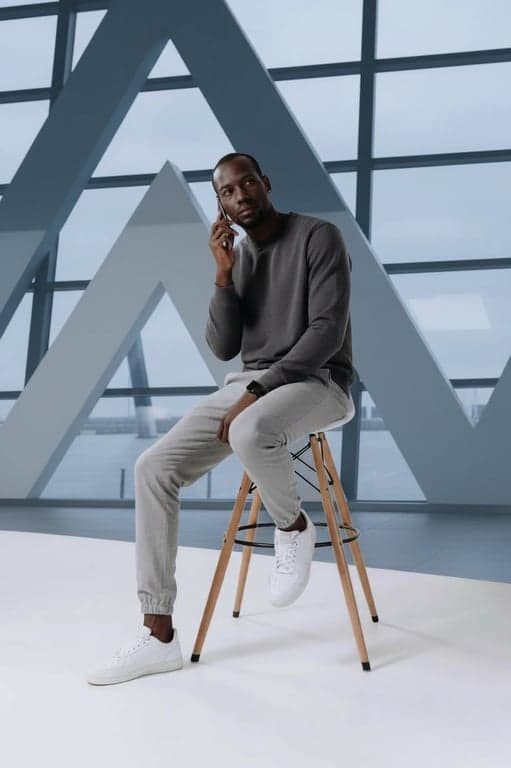 airport outfits filter after transformation - portrait wearing relaxed airport travel outfit with soft layers and sneakers