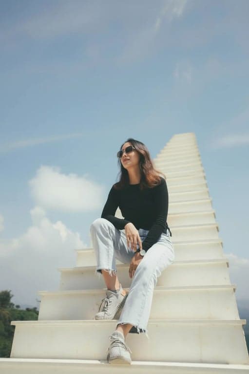 transform the photo into a strong dating app profile image by improving facial light distribution, refining jawline definition, enhancing eye clarity, correcting posture and framing, reducing distracting objects in the background, maintaining natural skin texture and realistic detail, and producing a result that looks intentionally selected for first impressions