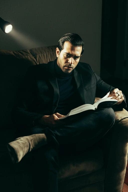 a portrait of a man in a horror cinematic style, with desaturated colors, unsettling green tint, and a single source flashlight effect