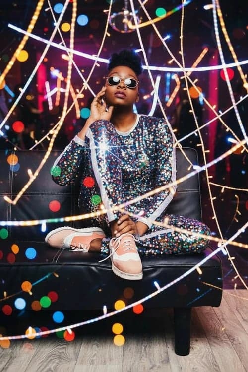 Holiday party outfit after image - person wearing a high-shine sequin jumpsuit ready for party