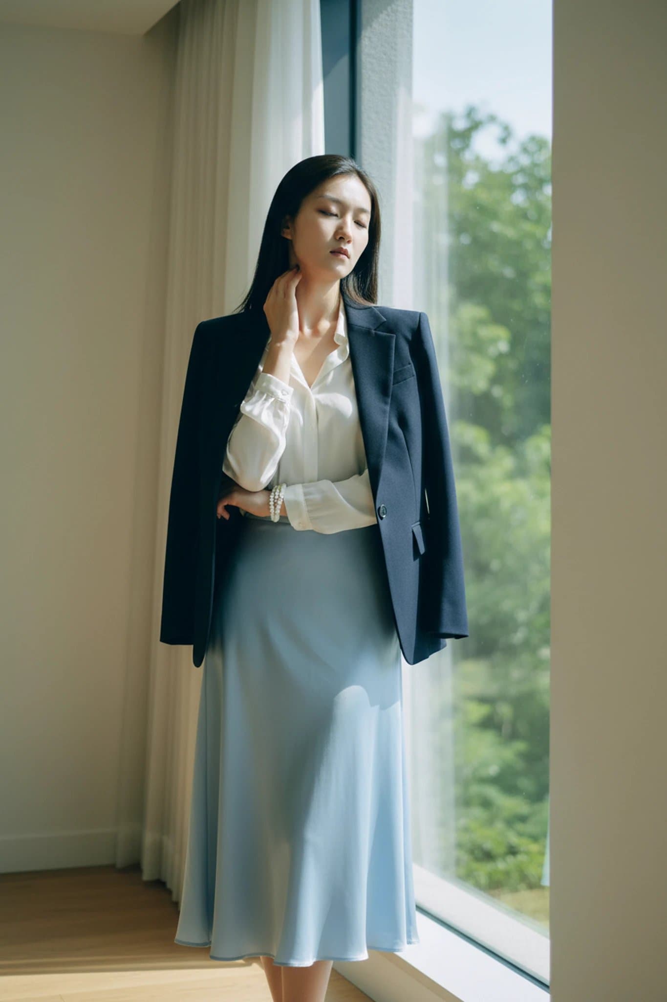 Chic Style filter after transformation - portrait in satin skirt and blazer chic outfit with natural window light
