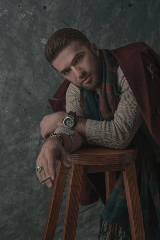 a portrait of a man, ai business portrait, sharp focus on face, professional haircut, subtle skin retouching, clean background.