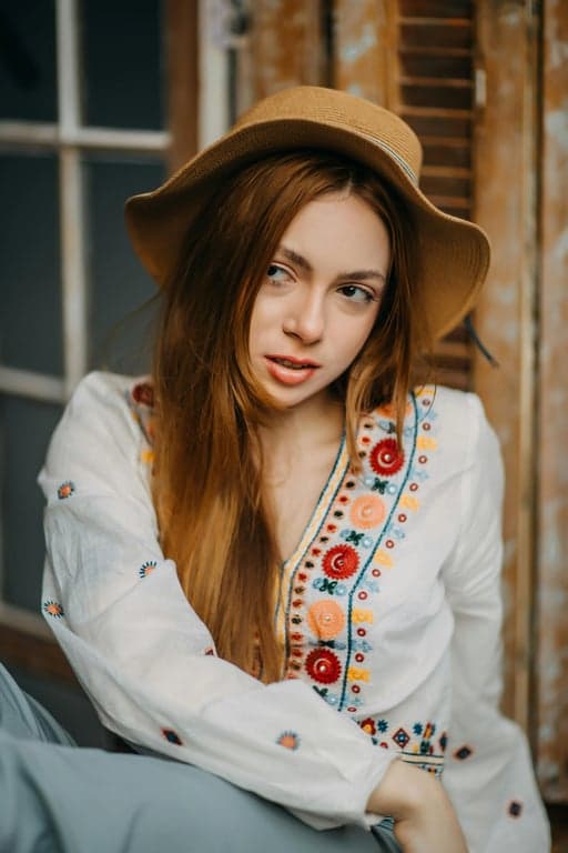 A portrait of a person transformed into a genuine My Little Pony-style pony character with strict four-leg ground contact, classic pony proportions, short legs with hooves, oversized eyes, no human silhouette, no human skin texture, no humanoid gestures, identity preserved through color harmony, mane design, and eye expression, original background preserved, clean cel-shaded animation style, personality-driven cutie mark.