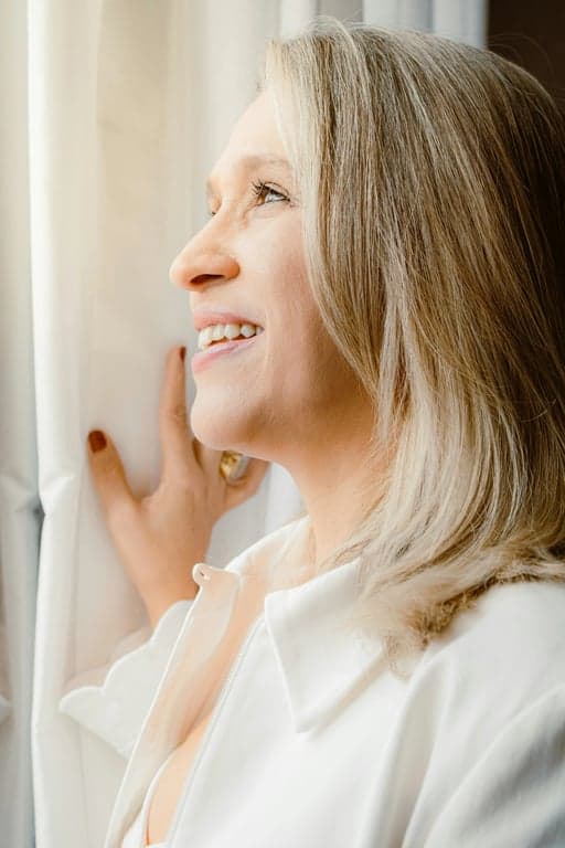 a portrait with a comprehensive eye area enhancement, combining bag removal, slight lift effect, and overall skin tone unification