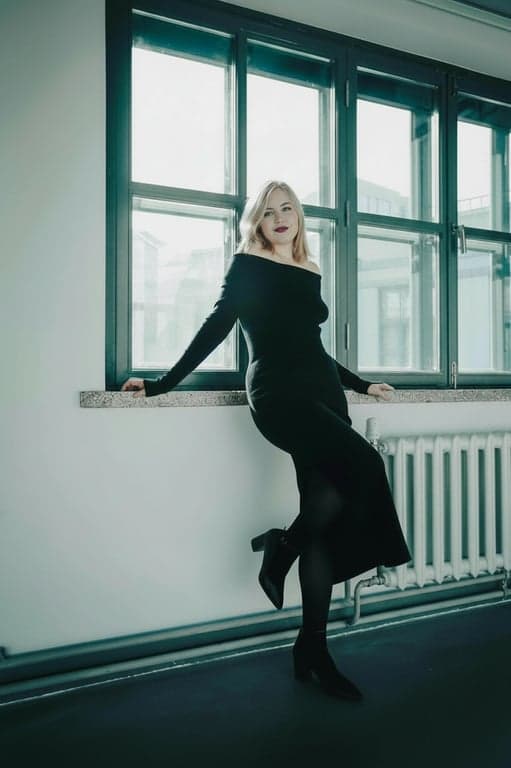 a portrait of a person transformed to create an extreme waist slimming effect by heavily compressing the waist horizontally and leaving hips untouched, resulting in a strikingly narrow waist and a highly visible curvy outline