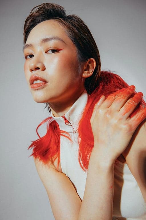 A portrait of a person transformed into an unmistakably quadruped My Little Pony pony, no arms or hands, no human posture, identity retained through mane styling, eye expression, and color palette, original background intact, pastel tones, animation-style shading, and a meaningful cutie mark.