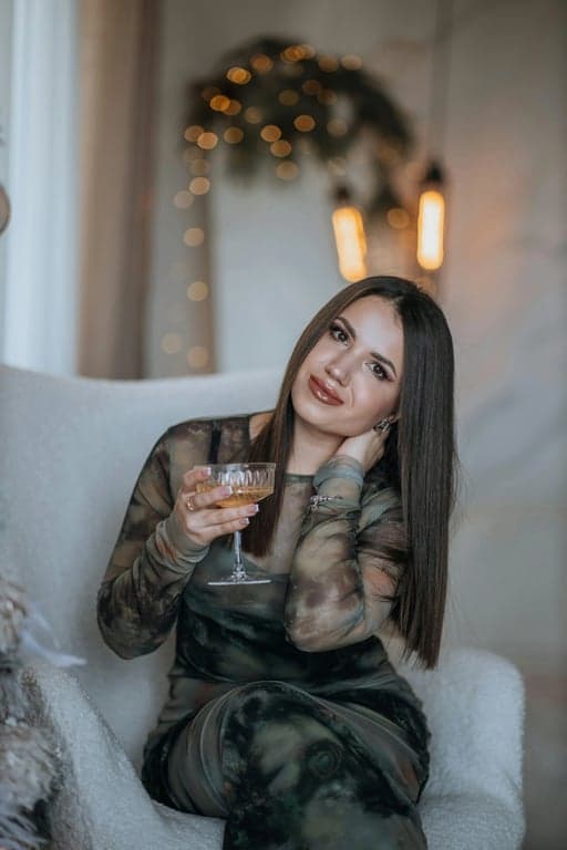 a portrait of a person refined to appear more sculpted in the lower face by carving out a clearer jaw silhouette, reducing visual roundness near the jaw corners; reinforce the mandibular line so the face reads more angular and structured; maintain natural bone structure; preserve skin grain and lighting direction; no background modification; the face shape should look intentionally stronger and more defined