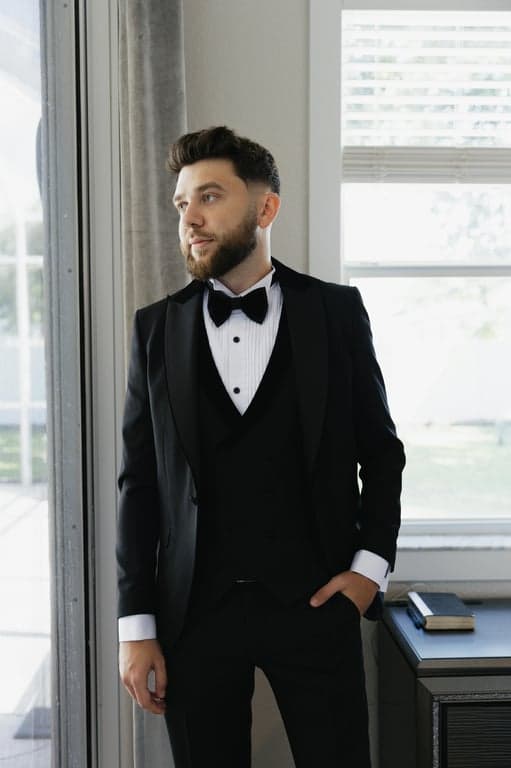 a portrait of a person reimagined in a mid-century American illustration style with simplified geometric facial shapes, clean bold outlines, flat retro color palette, minimal shading, and a classic optimistic American design aesthetic