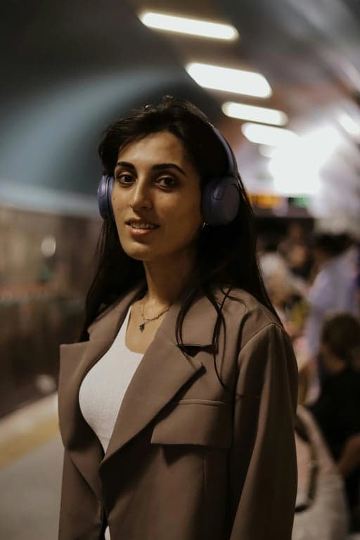 a portrait of a person styled as an executive profile photo with refined facial clarity, calm confident expression, formal business clothing, subtle rim light separating the subject from background, controlled contrast lighting, studio photography look, and an authoritative yet approachable professional tone