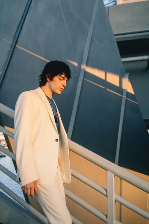 a portrait of a person recreated in a Marvel Rivals–inspired hero shooter art style with smooth realistic rendering, strong highlights, clean shadows, and dynamic game-ready appearance