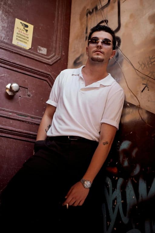 a portrait of a person recreated in an American Gothic painting aesthetic with calm intensity, precise structure, minimal flourish, and traditional American realism