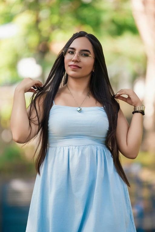 a portrait of a person edited to maximize waist-to-hip ratio by forcefully narrowing the waist and emphasizing hip width through contrast, producing a dramatic body shape transformation suitable for visual demonstrations