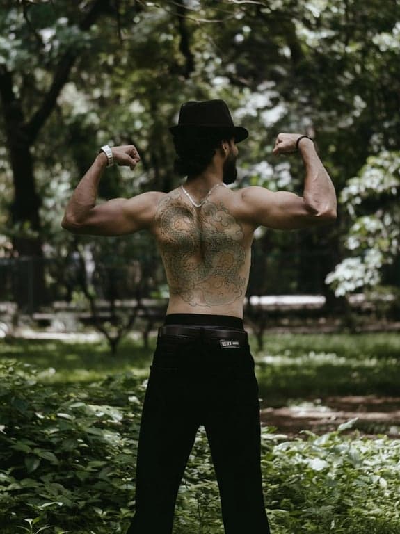 anime tattoo after photo - woman working out with anime tattoo