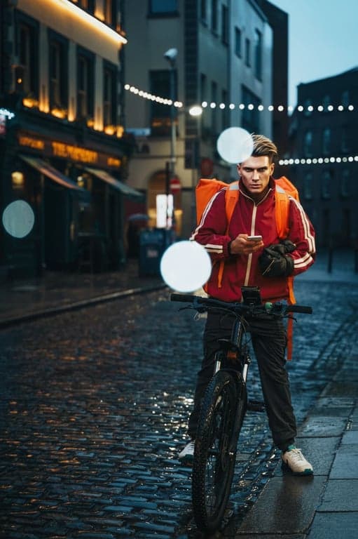 An editorial fashion photo of a man, polished skin, enhanced hair details, bold color grading, strong graphic composition, professional studio lighting.