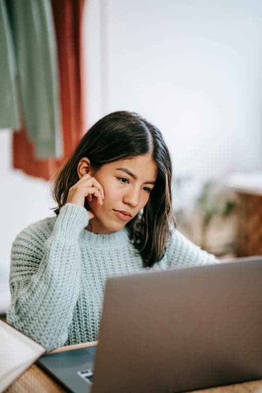 a portrait of a person styled with youthful summer outfit details, casual tops, relaxed shorts or skirts, bright tones, easy silhouettes, casual stance, and soft lighting
