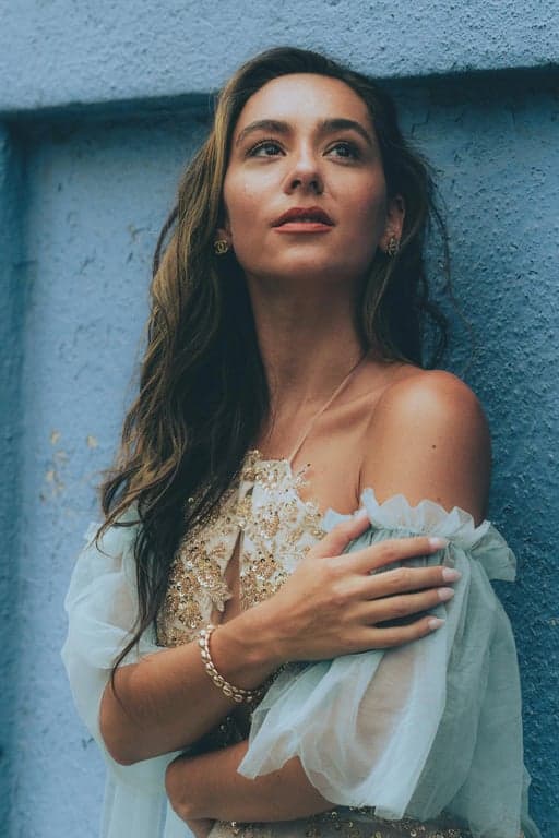 a portrait of a person illustrated in a classic Marvel comic book style with thick ink linework, exaggerated heroic facial proportions, strong contour shadows, flat color fills, limited gradients, and a recognizable printed comic book appearance