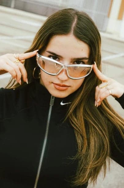 a portrait of a person enhanced with cinematic anime lighting, sharp facial contours, stylized clothing folds, high contrast shading, and a dramatic battle-ready atmosphere