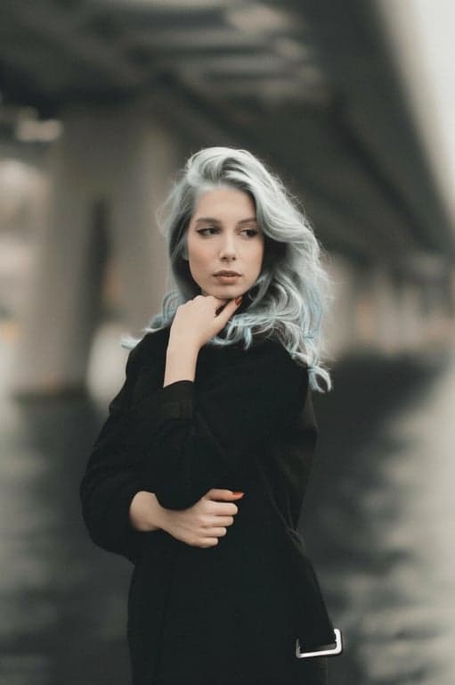 a portrait of a person reimagined with silver hair coloration, avoiding flat gray fill and emphasizing reflective highlights