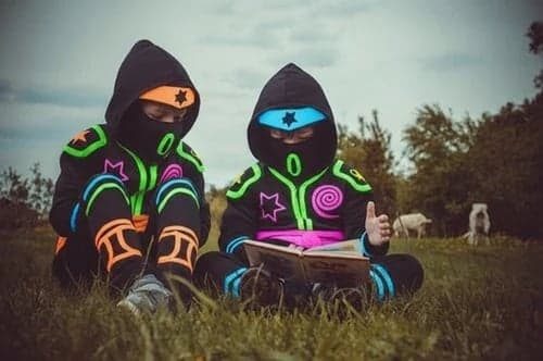 Kids ninja after – child in a glow ninja suit with luminous lines