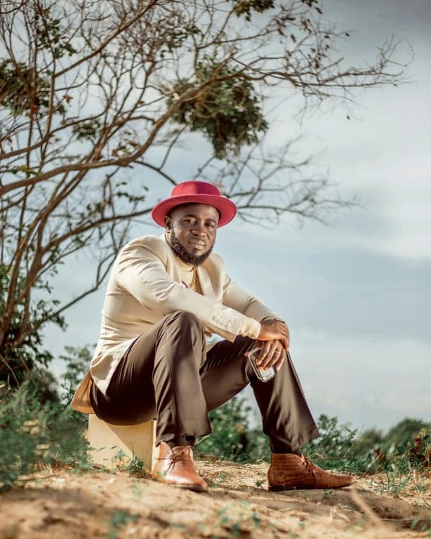 a portrait of a person enhanced with subtle aesthetic outfit styling, muted colors, balanced contrast, natural pose, and simple modern backdrop