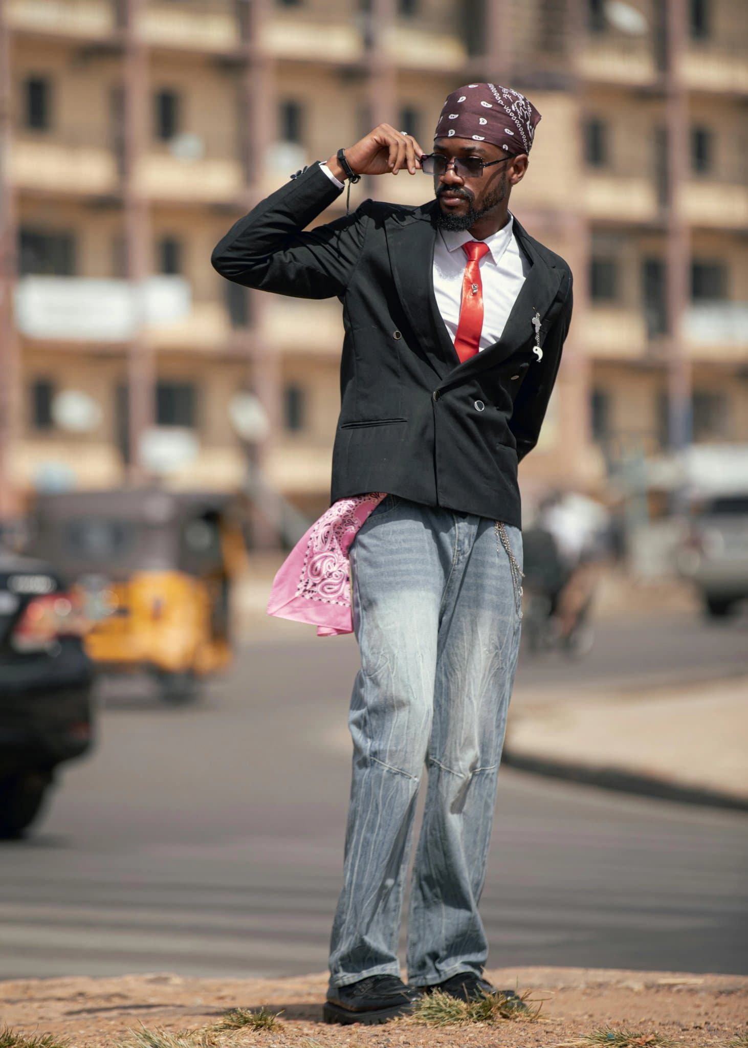 A photo of a person showing their arm, wearing a short-sleeved shirt or tank top.