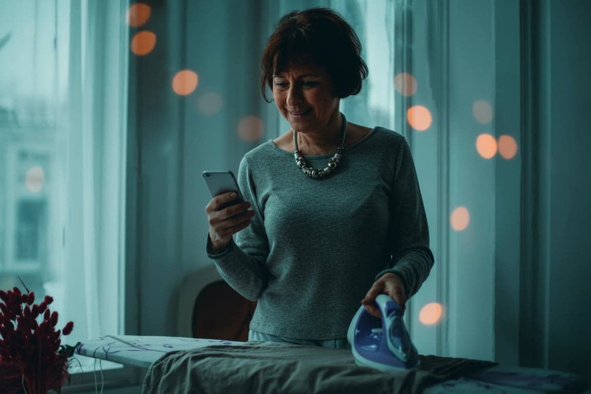 A moody cinematic portrait of a woman, featuring teal undertones in the shadows and warm orange accents on the skin, soft directional light, cinematic atmosphere, shallow focus.
