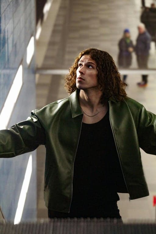 a portrait of a person reimagined as a Marvel Rivals superhero character with clean stylized realism, defined facial planes, confident heroic posture, sharp highlights, soft but controlled shadows, and a dynamic modern game art atmosphere