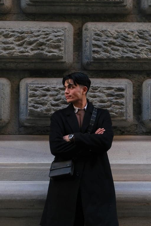 a portrait of a person illustrated in a shonen anime art style with thick contour lines, simplified shading blocks, vivid colors, and a confident heroic expression