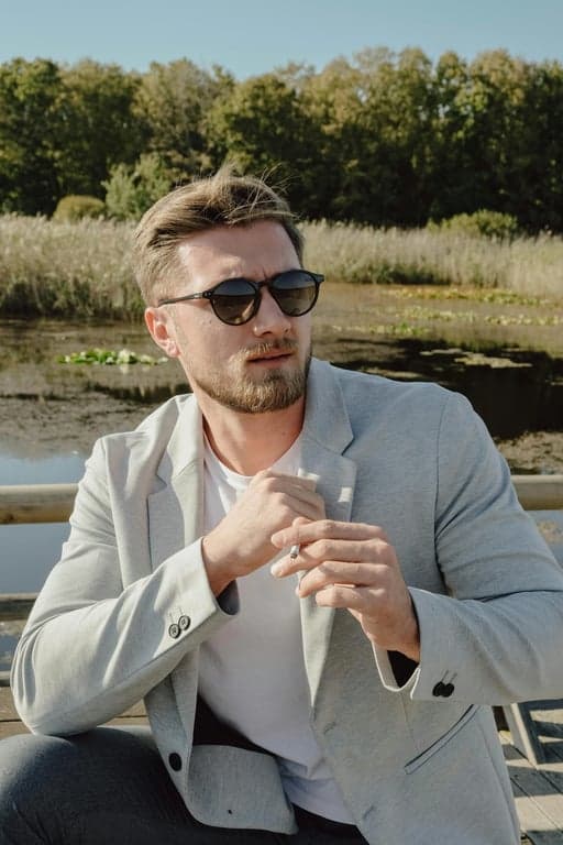 a portrait of a person styled with vivid pink hair, showing stronger saturation on mid-lengths, softer tone near roots, accurate hair volume, and realistic light reflection