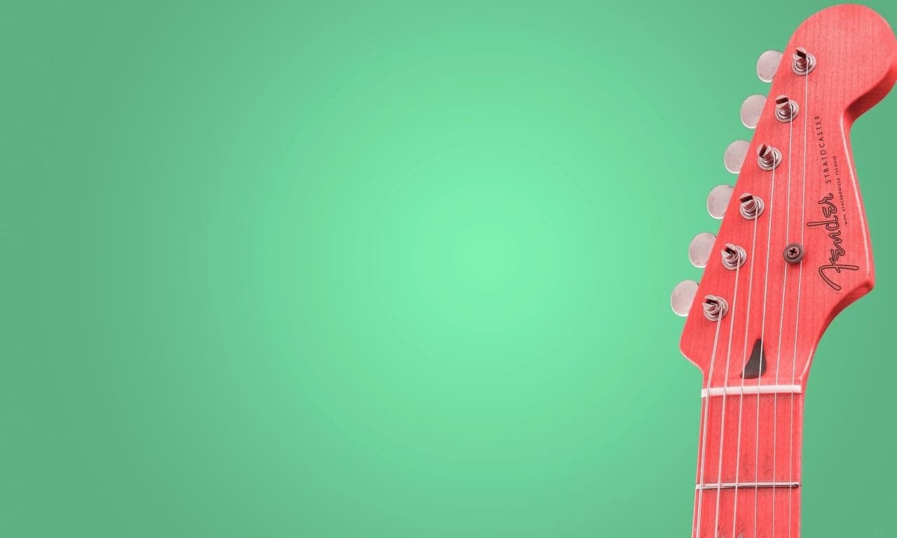 AI green screen remover before photo - red guitar placed on green background