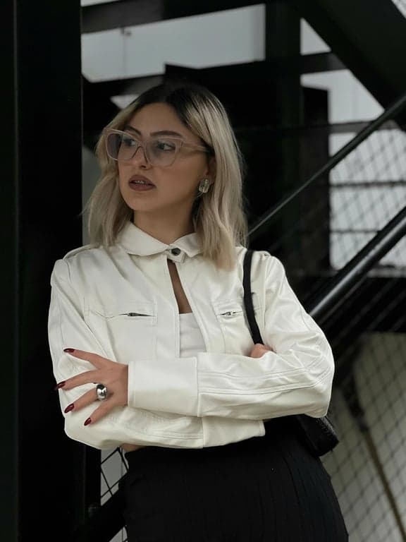 a portrait of a person processed with AI shadow removal, reducing dark shadow patches on the face and clothing, smoothing shadow transitions, and preserving accurate colors and surface detail