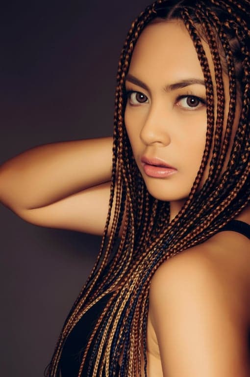 a portrait of a woman, virtual box braids try-on, various lengths and colors, realistic integration with natural hairline, front view.