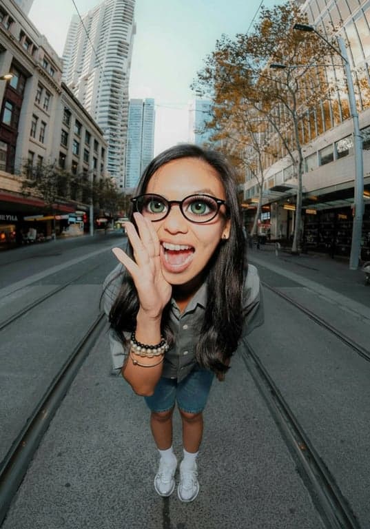 AI big eyes filter after photo - girl laughing outside after big eyes filter