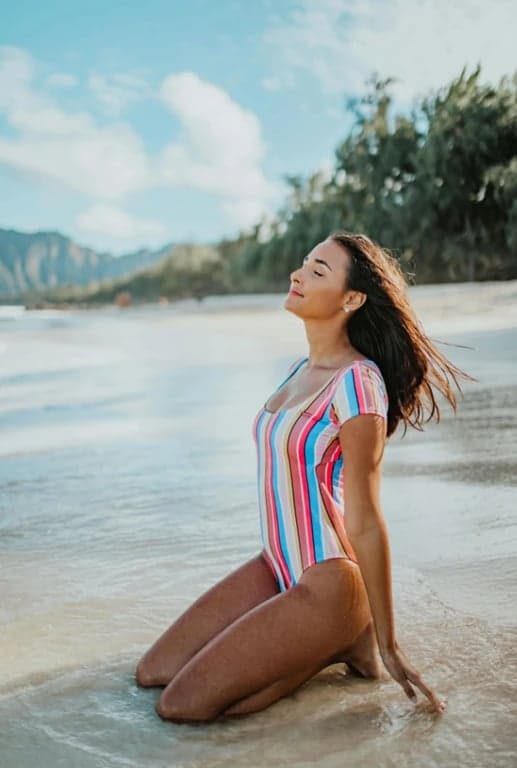 a portrait of a person with swimwear changed into a different design, maintaining natural anatomy, consistent fabric texture, balanced proportions, and clean visual edges