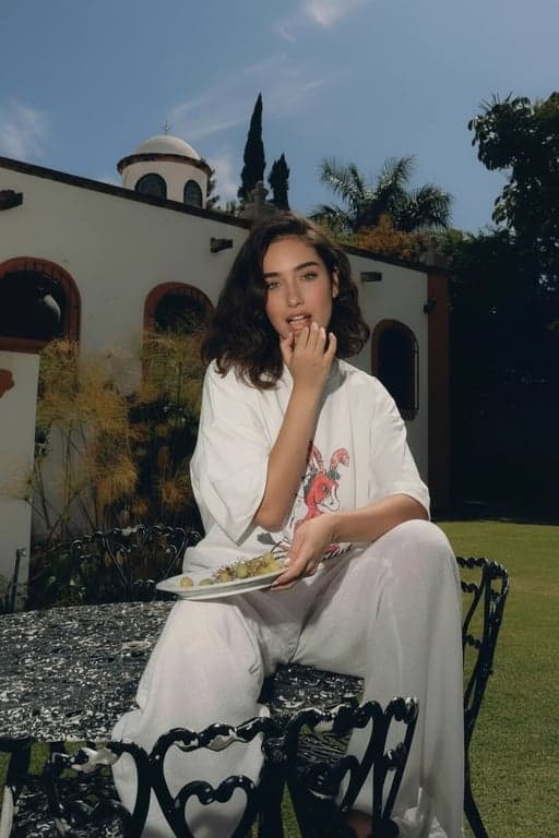 generate a dating profile image by improving facial visibility, correcting uneven exposure, enhancing eye brightness and sharpness, maintaining natural skin texture, keeping realistic proportions, refining posture to communicate confidence, reducing background distractions, and producing a result that looks intentionally chosen for online dating rather than a casual or accidental photo