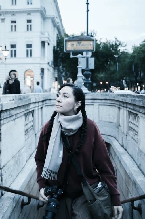 a portrait of a woman, cool tone filter, blue and teal undertones, soft diffused light, calm atmosphere, minimalist background.